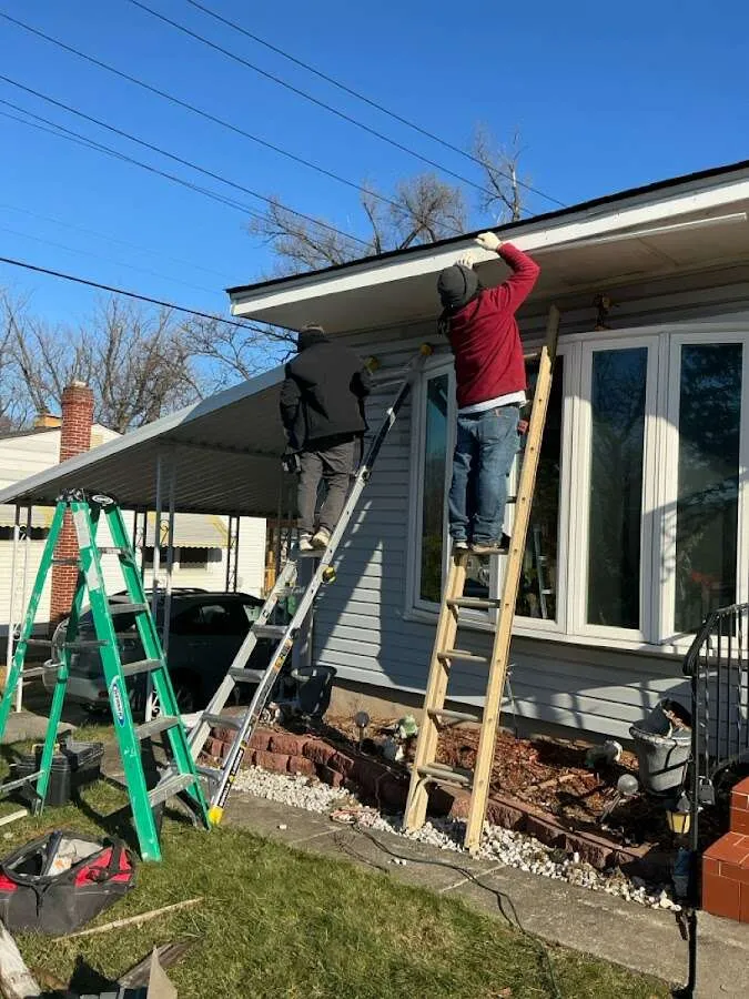Restoration crew performing exterior repair in German Flatts